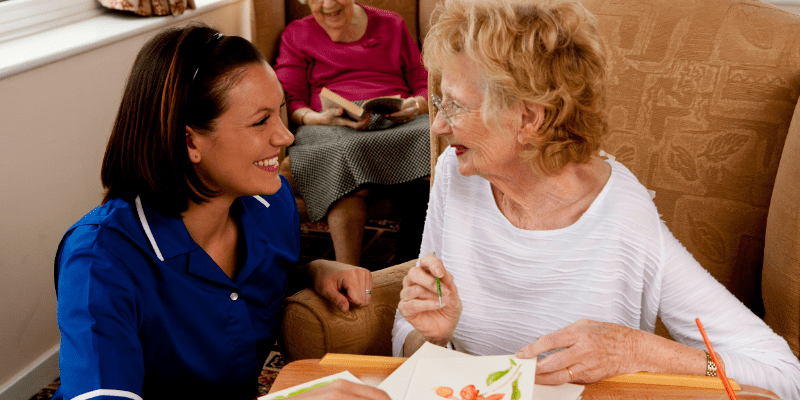 woman helps elderly women